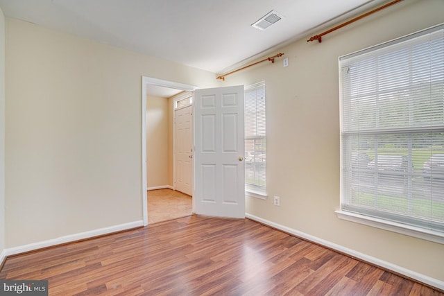 6187 Les Dorson Ln, Alexandria, VA 22315 - unfurnished room featuring wood finished floors and healthy amount of natural light