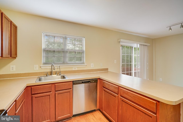 6187 Les Dorson Ln, Alexandria, VA 22315 - kitchen with stainless steel dishwasher, a peninsula, light countertops, and light wood-type flooring