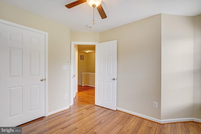 6187 Les Dorson Ln, Alexandria, VA 22315 - unfurnished bedroom featuring light wood finished floors and a ceiling fan