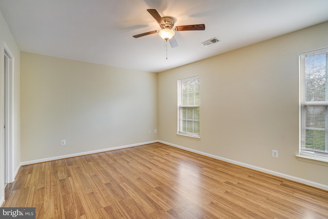 6187 Les Dorson Ln, Alexandria, VA 22315 - unfurnished room with light wood finished floors, healthy amount of natural light, and ceiling fan