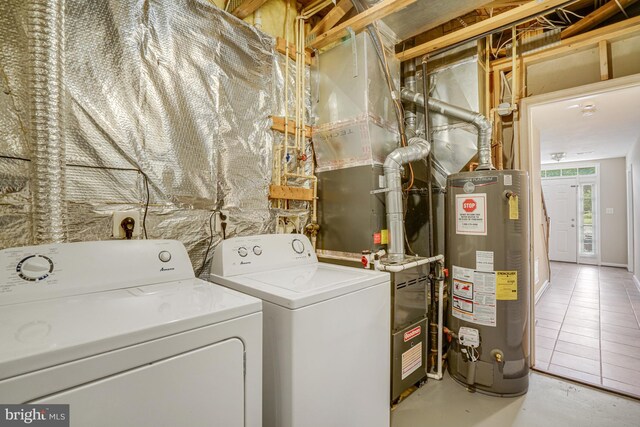 6187 Les Dorson Ln, Alexandria, VA 22315 - laundry area featuring water heater and independent washer and dryer