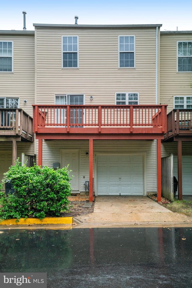 6187 Les Dorson Ln, Alexandria, VA 22315 - rear view of property featuring an attached garage and concrete driveway