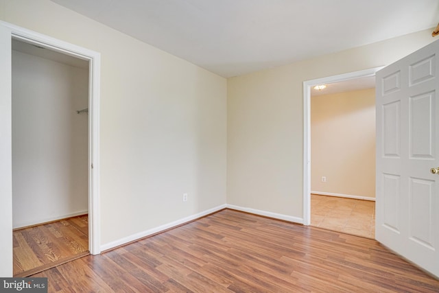 6187 Les Dorson Ln, Alexandria, VA 22315 - unfurnished bedroom featuring wood finished floors and baseboards