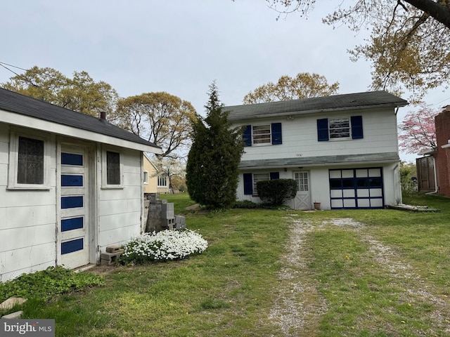 1930 Cedar Rd, Pasadena, MD 21122 - back of house featuring a garage, a lawn, and driveway