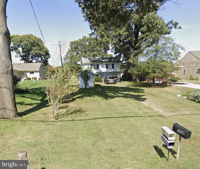 1930 Cedar Rd, Pasadena, MD 21122 - view of front facade with a front lawn