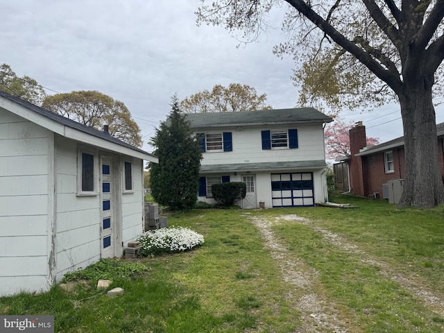 1930 Cedar Rd, Pasadena, MD 21122 - view of front facade featuring an attached garage, a front yard, and driveway