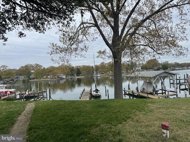 1930 Cedar Rd, Pasadena, MD 21122 - dock area featuring boat lift, a lawn, and a water view