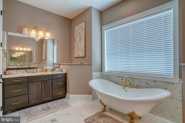 22261 Waterview Rd, Lewes, DE 19958 - bathroom featuring marble finish flooring, a soaking tub, and vanity