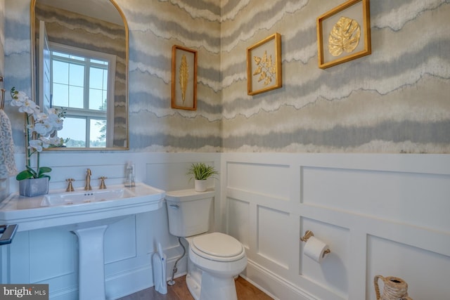 22261 Waterview Rd, Lewes, DE 19958 - half bath featuring a decorative wall and a wainscoted wall