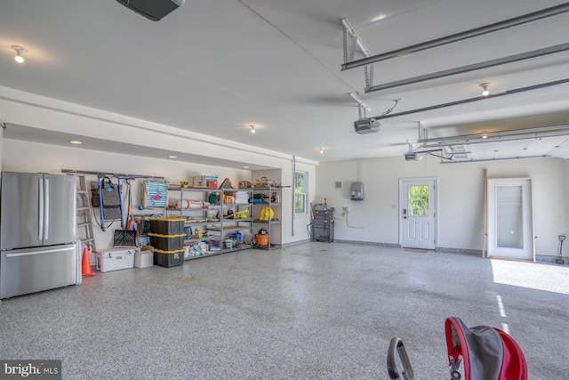 22261 Waterview Rd, Lewes, DE 19958 - garage with freestanding refrigerator and a garage door opener