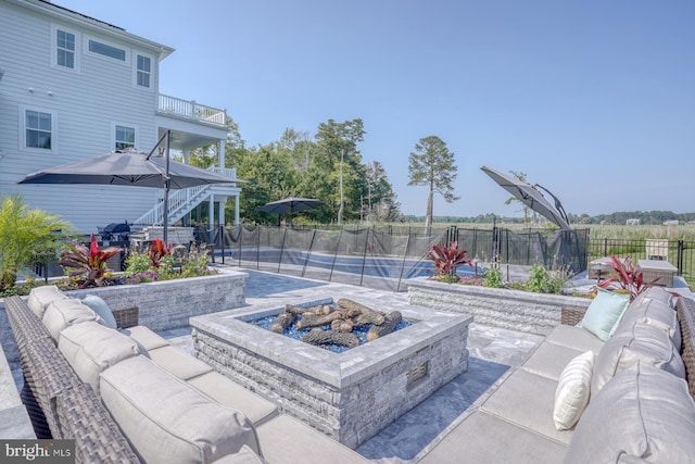 22261 Waterview Rd, Lewes, DE 19958 - patio / terrace featuring an outdoor living space with a fire pit, a swimming pool, a patio area, and stairs