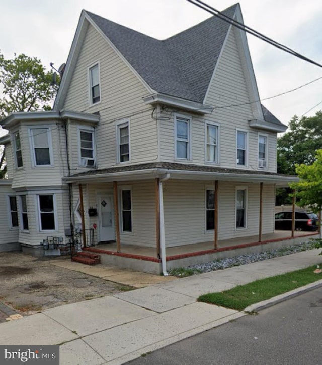 312 N 2nd St, Millville, NJ 08332 - view of property with a porch and roof with shingles