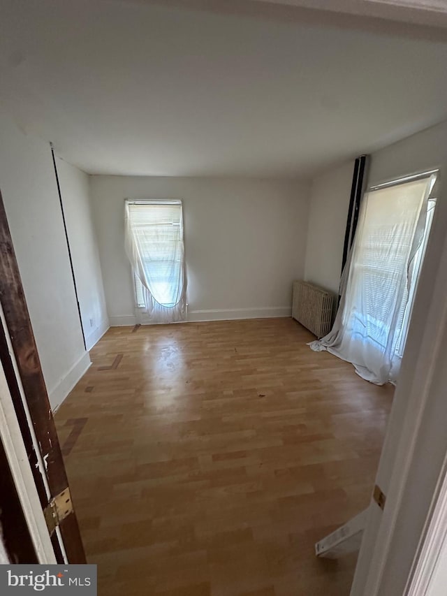 312 N 2nd St, Millville, NJ 08332 - unfurnished room with light wood-type flooring and radiator
