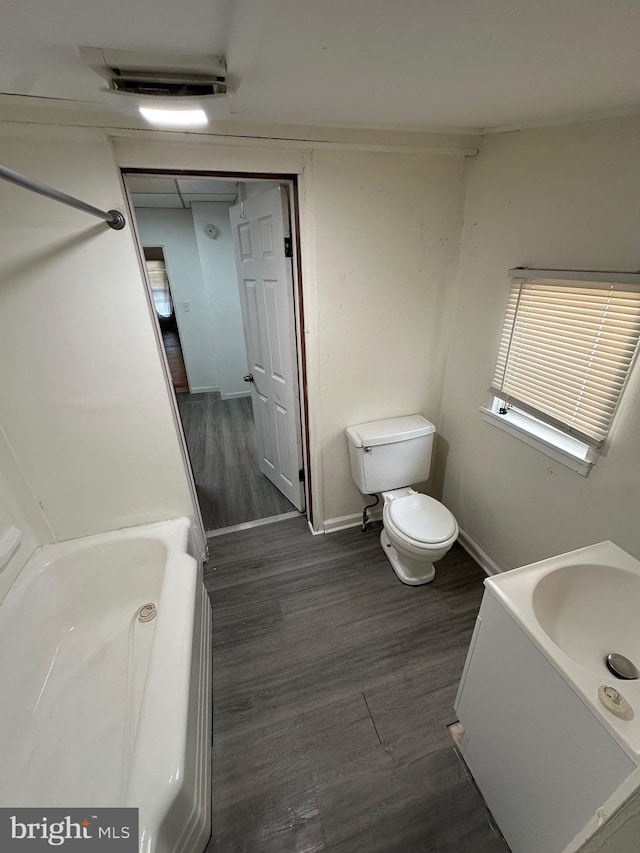 312 N 2nd St, Millville, NJ 08332 - bathroom featuring a tub, wood finished floors, and vanity