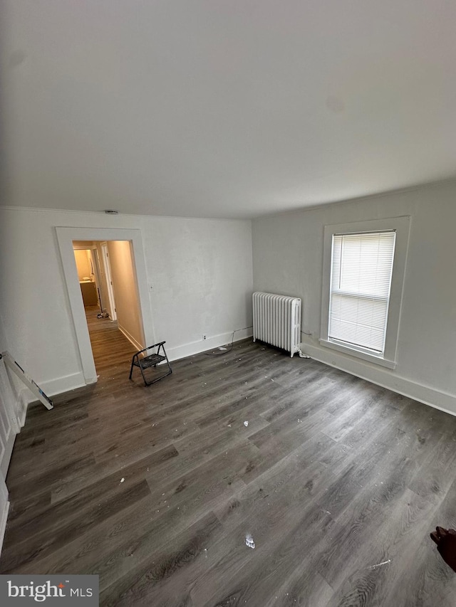 312 N 2nd St, Millville, NJ 08332 - unfurnished room with radiator heating unit and dark wood-style floors