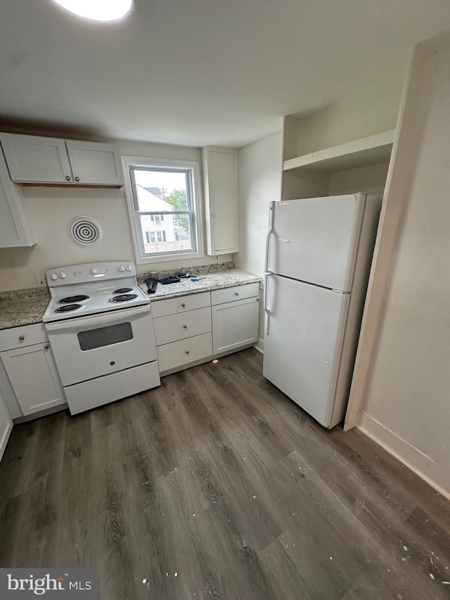312 N 2nd St, Millville, NJ 08332 - kitchen featuring white appliances, dark wood-type flooring, and white cabinetry