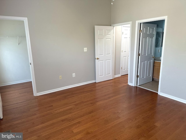 20 Harbour Heights Dr Unit 20, Annapolis, MD 21401 - unfurnished bedroom featuring a walk in closet, wood finished floors, a closet, and ensuite bathroom