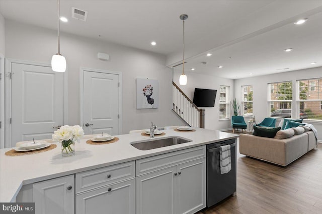 10544 Sally Ride Ln, Lanham, MD 20706 - kitchen featuring stainless steel dishwasher, open floor plan, pendant lighting, dark wood-style flooring, and recessed lighting