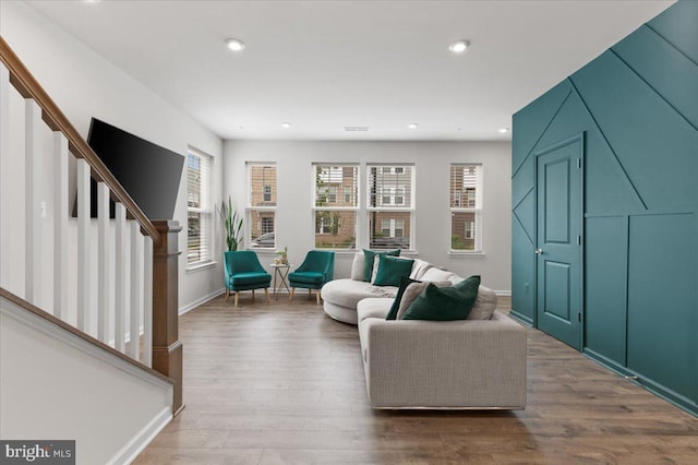 10544 Sally Ride Ln, Lanham, MD 20706 - living room featuring stairway, wood finished floors, and recessed lighting