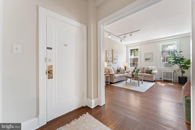 1623 Lanier Pl NW Unit 202, Washington, DC 20009 - entrance foyer with radiator heating unit, dark wood-style floors, and rail lighting