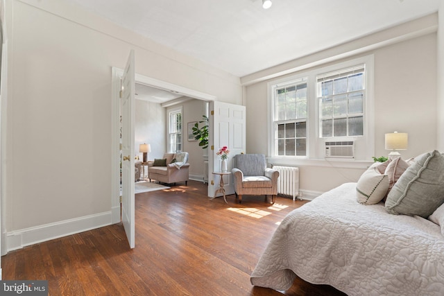 1623 Lanier Pl NW Unit 202, Washington, DC 20009 - bedroom featuring radiator, wood finished floors, cooling unit, and multiple windows
