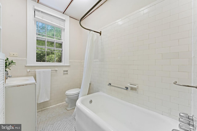 1623 Lanier Pl NW Unit 202, Washington, DC 20009 - bathroom with tile walls, vanity, shower / tub combo with curtain, tile patterned flooring, and a wainscoted wall