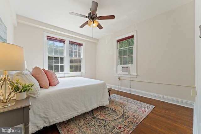 1623 Lanier Pl NW Unit 202, Washington, DC 20009 - bedroom featuring wood finished floors, multiple windows, cooling unit, and a ceiling fan