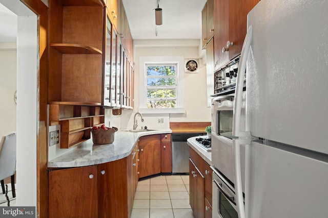 1623 Lanier Pl NW Unit 202, Washington, DC 20009 - kitchen featuring freestanding refrigerator, dishwasher, light tile patterned floors, and light countertops