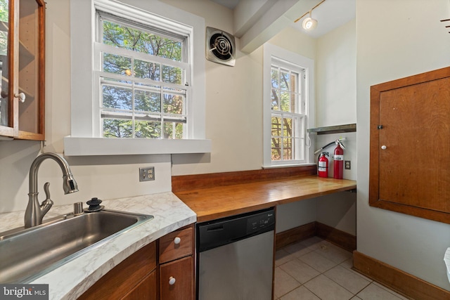 1623 Lanier Pl NW Unit 202, Washington, DC 20009 - kitchen featuring stainless steel dishwasher, light tile patterned floors, and wood counters