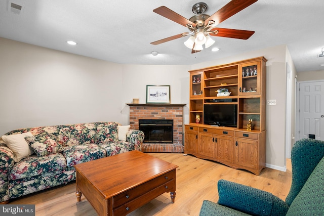 18275 Rolling Meadow Way, Olney, MD 20832 - living room featuring light wood-style floors, a ceiling fan, a brick fireplace, and recessed lighting