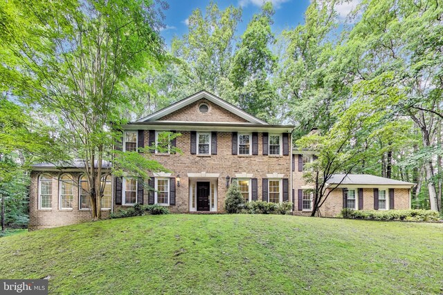 6536 Little Ox Rd, Fairfax Station, VA 22039 - view of front of house featuring a front yard and brick siding