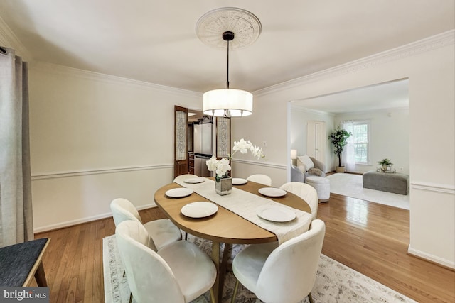 6536 Little Ox Rd, Fairfax Station, VA 22039 - dining space featuring wood finished floors and crown molding