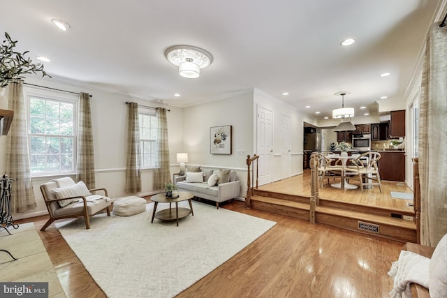 6536 Little Ox Rd, Fairfax Station, VA 22039 - living area with light wood-type flooring, ornamental molding, and recessed lighting