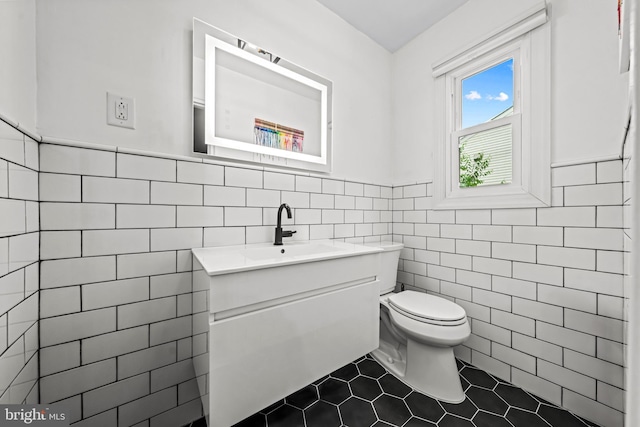 202 Cranford Rd, Cherry Hill, NJ 08003 - bathroom featuring tile walls, vanity, a wainscoted wall, and tile patterned floors