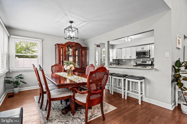 202 Cranford Rd, Cherry Hill, NJ 08003 - dining space featuring plenty of natural light, dark wood finished floors, and a chandelier