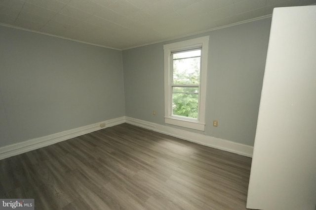 703 Baker St, Cumberland, MD 21502 - spare room with crown molding and dark wood finished floors