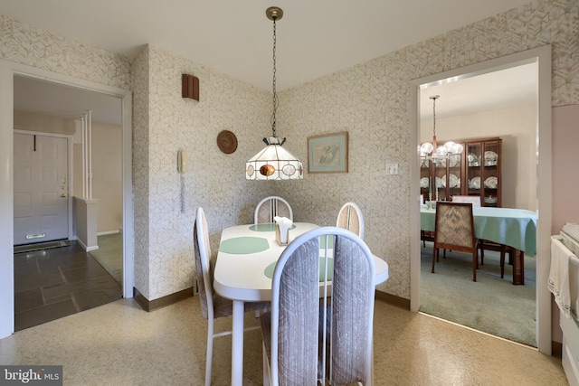 2202 Burkey Dr, Reading, PA 19610 - dining area with wallpapered walls and a chandelier