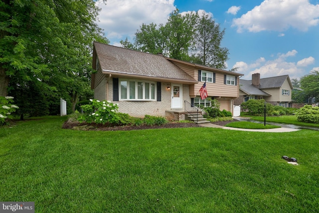 2202 Burkey Dr, Reading, PA 19610 - tri-level home featuring brick siding, a garage, and a front lawn