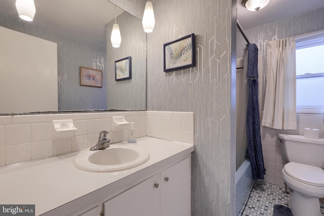 2202 Burkey Dr, Reading, PA 19610 - full bathroom featuring vanity, tile patterned flooring, shower / bath combo with shower curtain, wallpapered walls, and tile walls