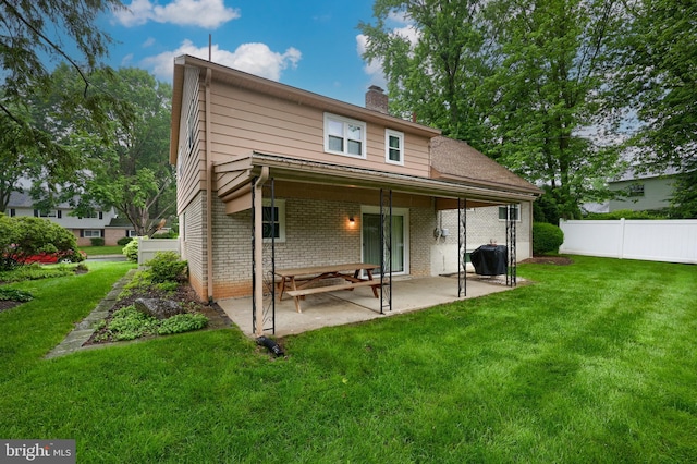 2202 Burkey Dr, Reading, PA 19610 - rear view of property with brick siding, a patio, and a chimney