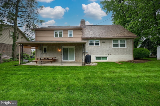 2202 Burkey Dr, Reading, PA 19610 - back of house with a chimney, brick siding, a patio area, and a lawn
