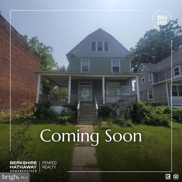4011 Kathland Ave, Baltimore, MD 21207 - farmhouse-style home with a porch, a front lawn, and stairway