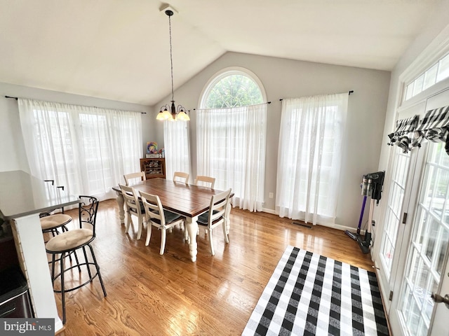 16331 Eagle Flight Cir, Woodbridge, VA 22191 - dining area with a chandelier, light wood-style flooring, and lofted ceiling