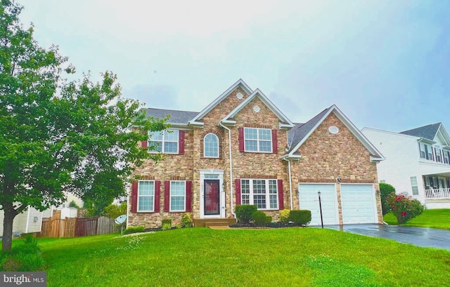 16331 Eagle Flight Cir, Woodbridge, VA 22191 - view of front of house with stone siding, asphalt driveway, and an attached garage