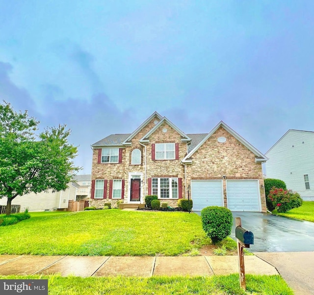 16331 Eagle Flight Cir, Woodbridge, VA 22191 - view of front of property featuring driveway, a front yard, and stone siding