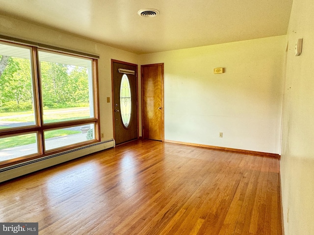 13709 Fir Tree Ln, Cresaptown, MD 21502 - empty room featuring wood finished floors and a baseboard radiator
