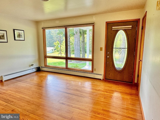 13709 Fir Tree Ln, Cresaptown, MD 21502 - foyer entrance featuring baseboard heating and light wood-style floors