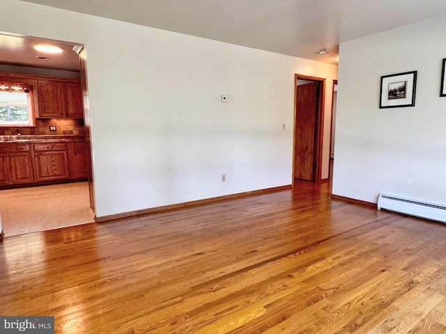 13709 Fir Tree Ln, Cresaptown, MD 21502 - unfurnished room with light wood-style floors and baseboard heating