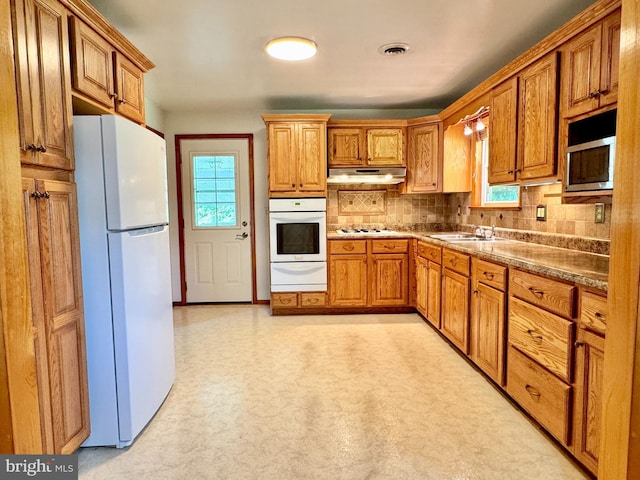 13709 Fir Tree Ln, Cresaptown, MD 21502 - kitchen featuring white appliances, a warming drawer, healthy amount of natural light, and under cabinet range hood