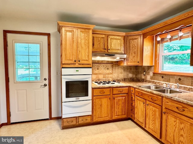 13709 Fir Tree Ln, Cresaptown, MD 21502 - kitchen with white appliances, a warming drawer, under cabinet range hood, and tasteful backsplash